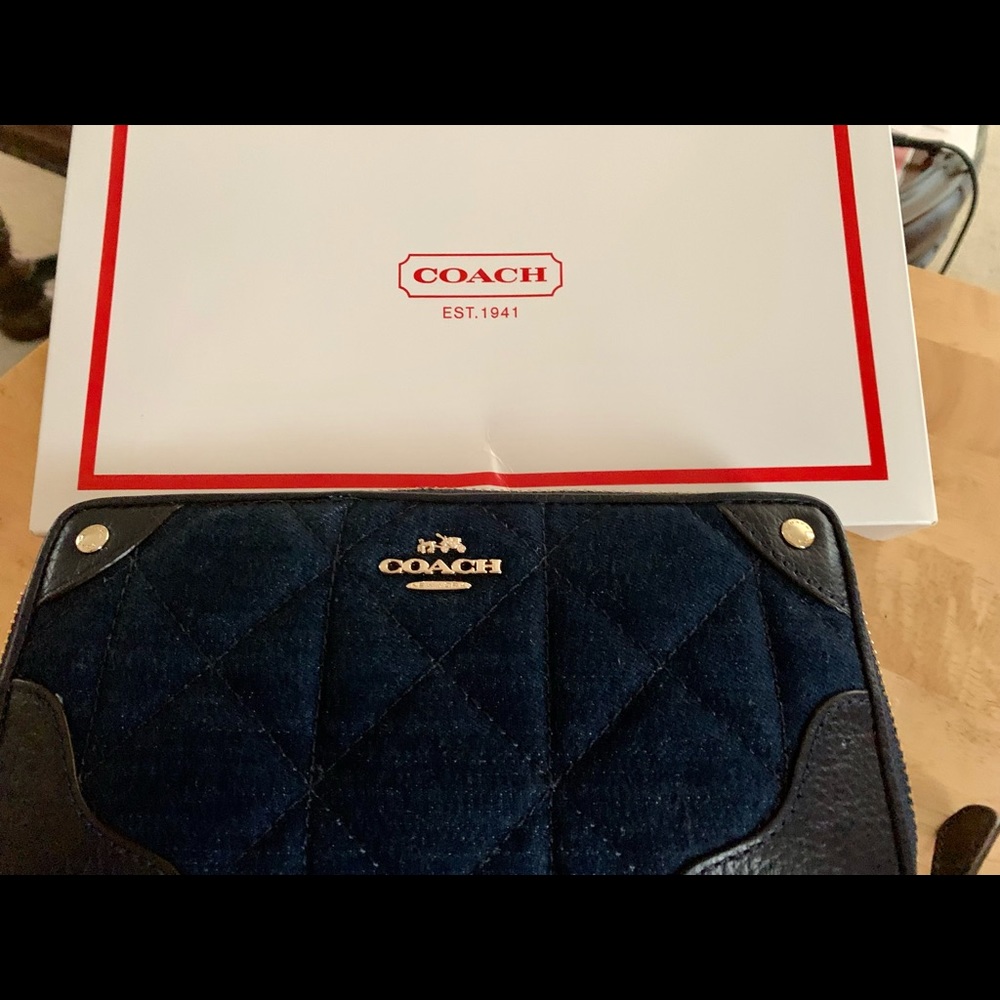 Coach Denim and Leather trimming. 
Full-length bill compartments
Zip coin pocket